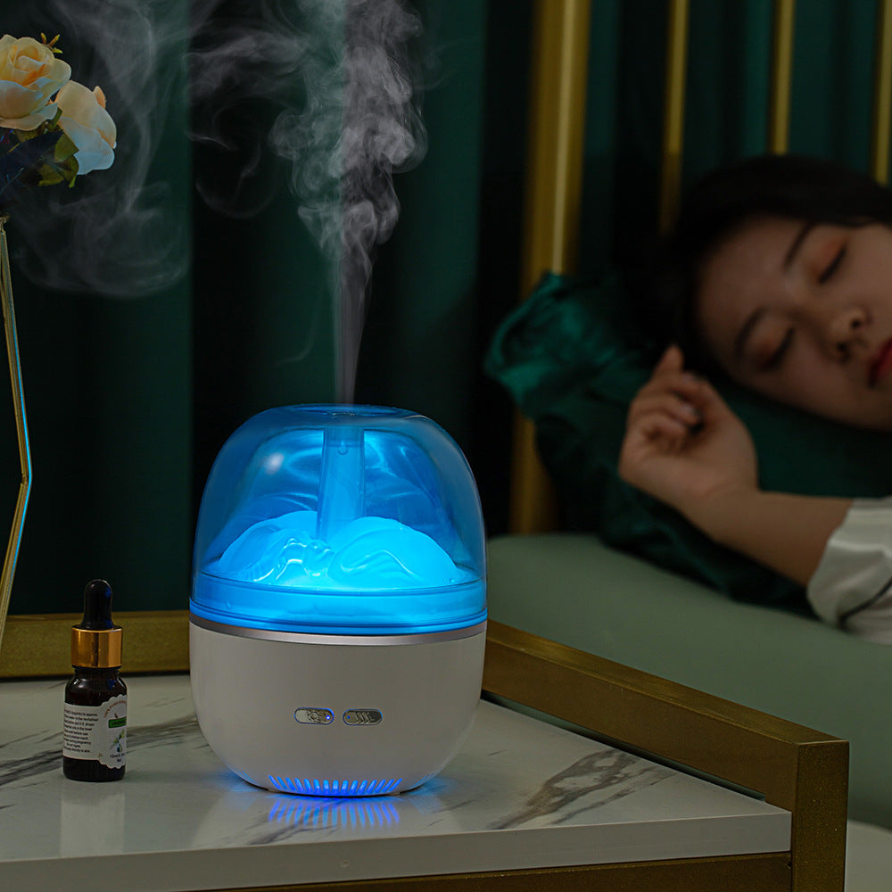 Liten aromdiffuser med färgskiftande ljus och tät kall dimma
